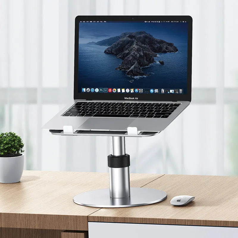 Silver adjustable aluminium alloy laptop stand on a car back seat, showing height adjustment and ventilation holes.