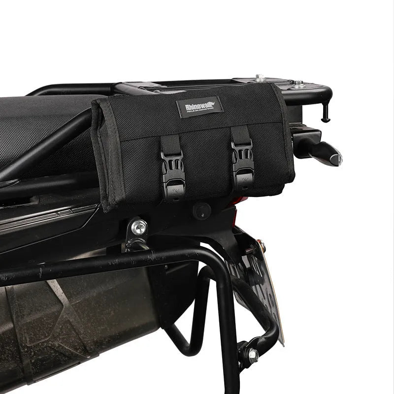 Motorcycle tool storage roll unfolded showing 8 elastic straps and mesh zipper pouch in black polyester fabric