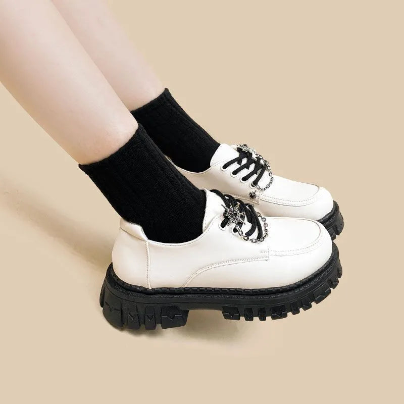 Women's Duke Asterism coloured loafers with a metal cross-strap and round toe in a preppy style.