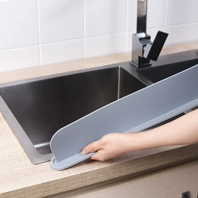 Silicone kitchen sink water blocking plate in grey, blue or black measuring 52mm wide by 85mm long