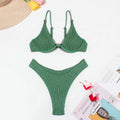 Green women's bikini with ruffle detail on quick-dry polyester fabric.