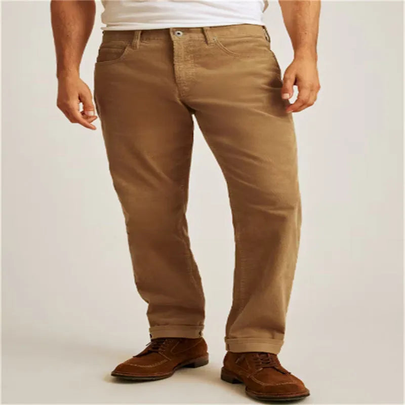 Loose fit solid green corduroy casual straight leg trousers on a mid-waist.
