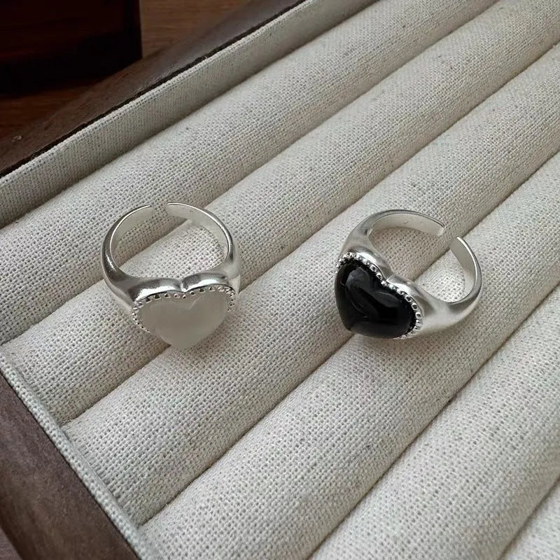 S925 sterling silver ring with black heart agate stone on an adjustable band.
