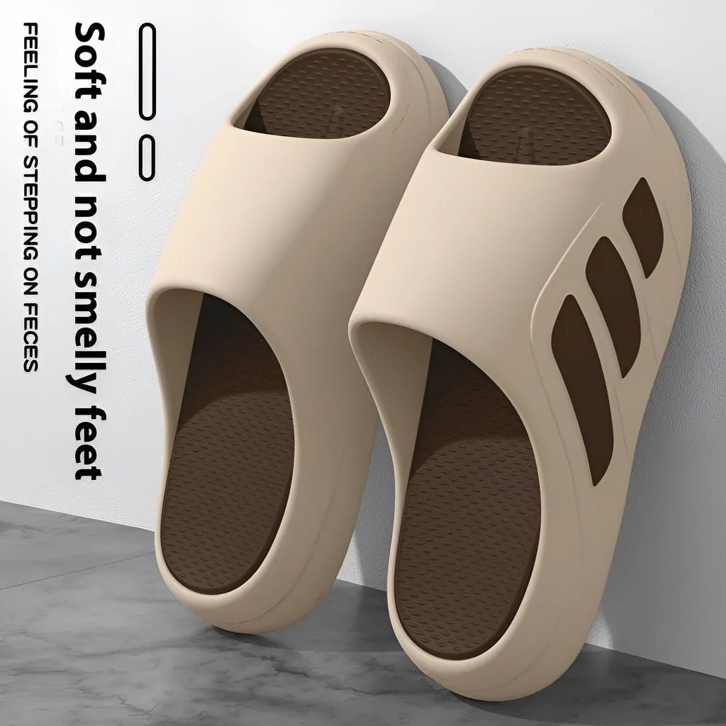 Brown and black two-tone EVA platform slippers with injection moulded soles on wooden floor