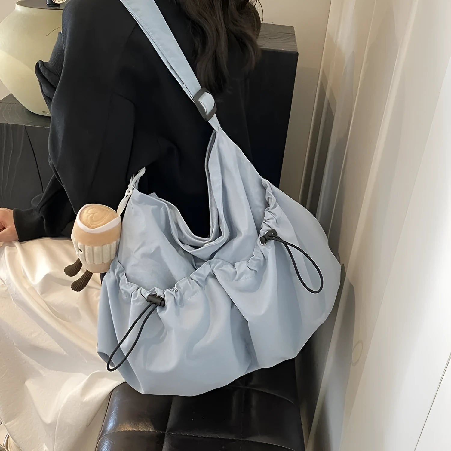 Green ultra-light pleated polyester crossbody bag with a split pocket, shown folded and open.