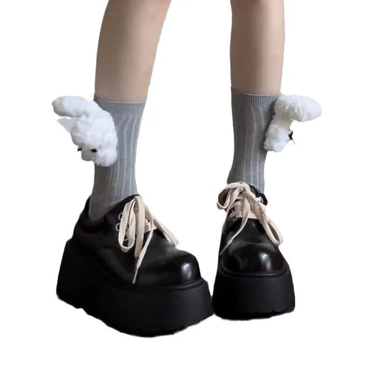Women's matte black lace-up platform ankle boots with a thick sole and round toe.