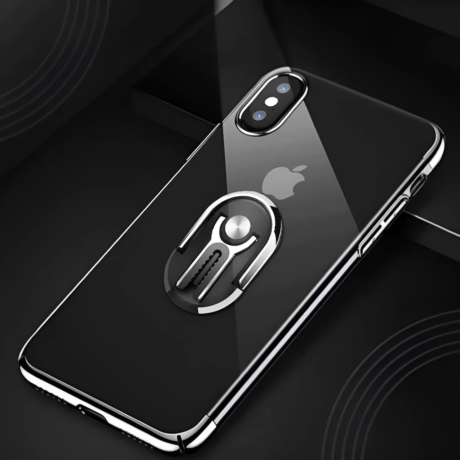 Black universal car phone mount with 360-degree rotation shown on a car dashboard.