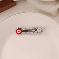 Red love heart shaped barrette hair clip with retro white dot design on black background