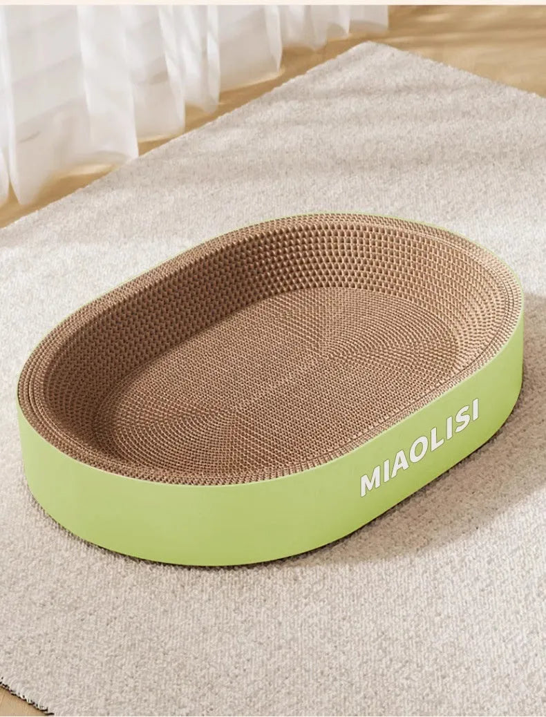 Green oval corrugated paper cat scratch board and nest showing textured surface and 55cm diameter.