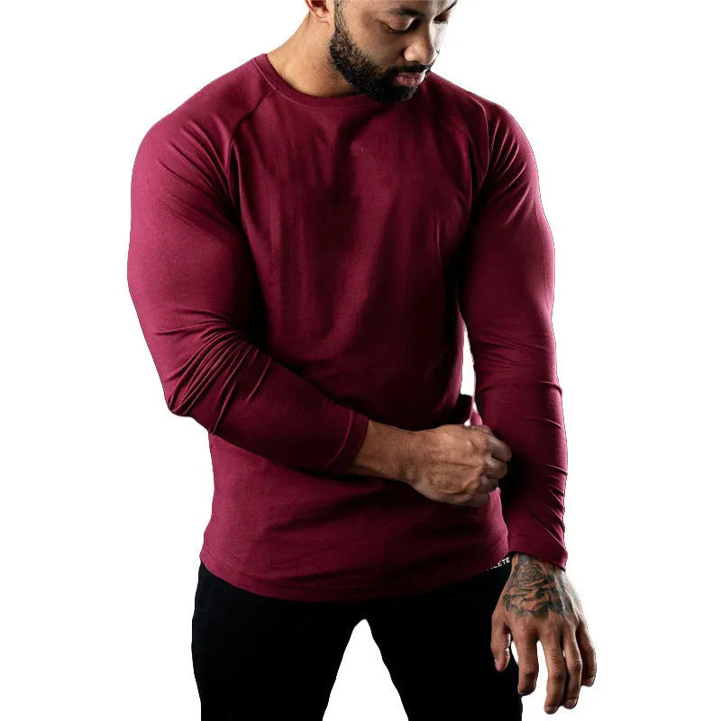 Men's fitted long sleeve cotton sports t-shirt in Army Green, shown on a model.