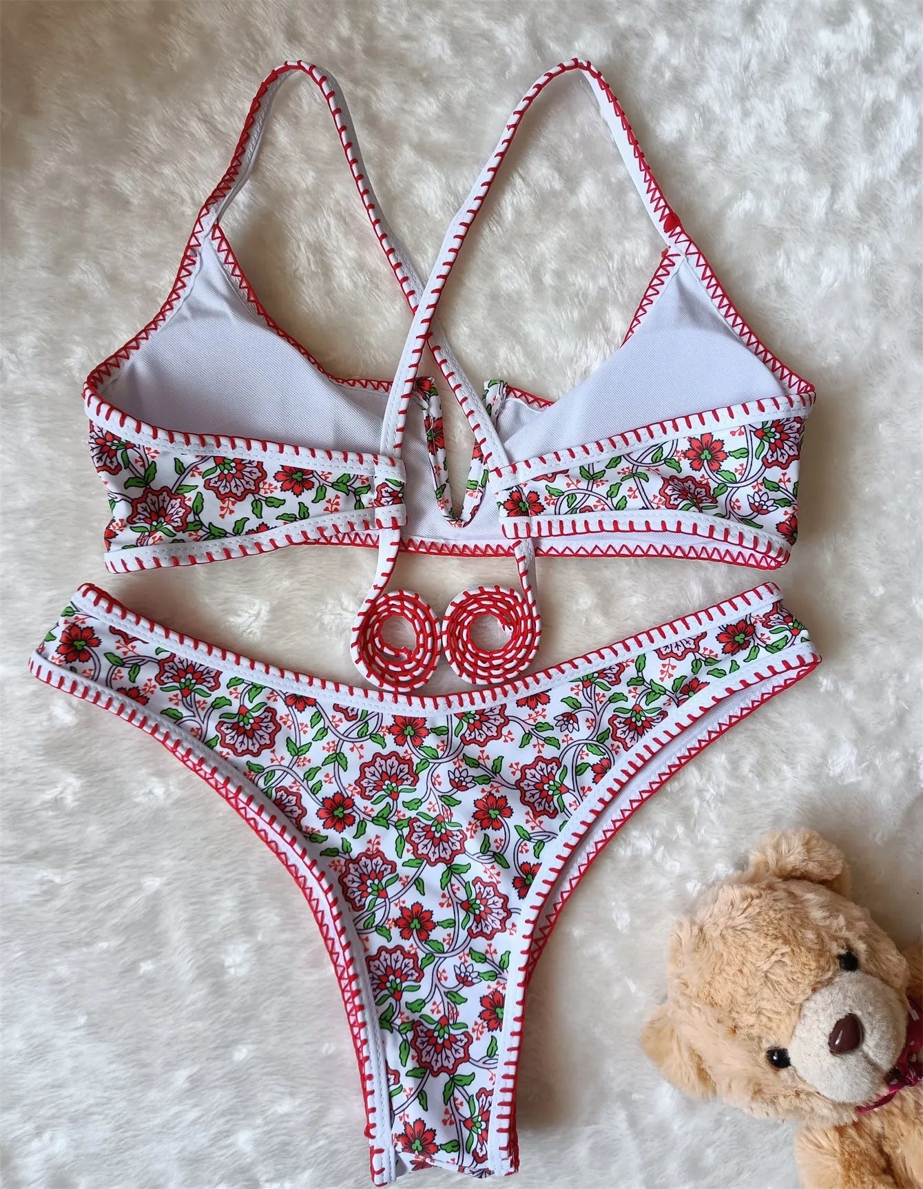 V-neck swimsuit with floral embroidery and printed patterns in brief cut design