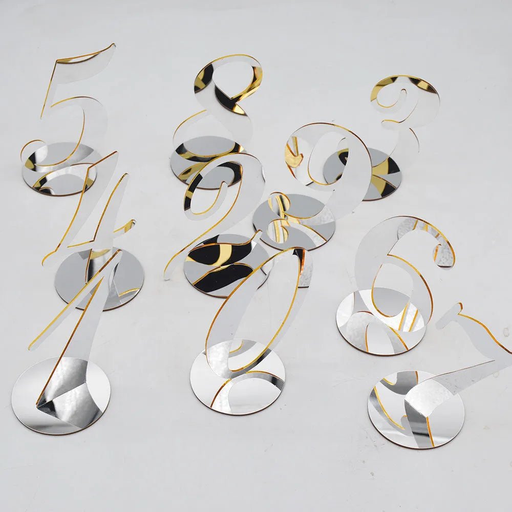 Clear acrylic table number holder with gold base displaying number 1 on a table