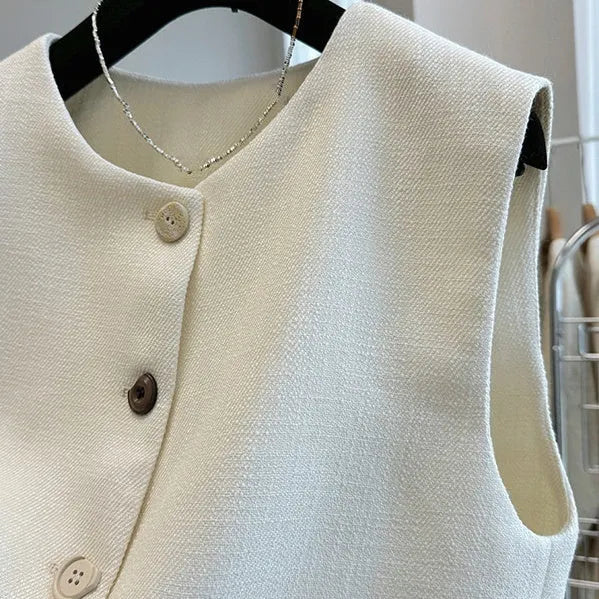 Women's beige round neck sleeveless bandage vest, French style, on a hanger.