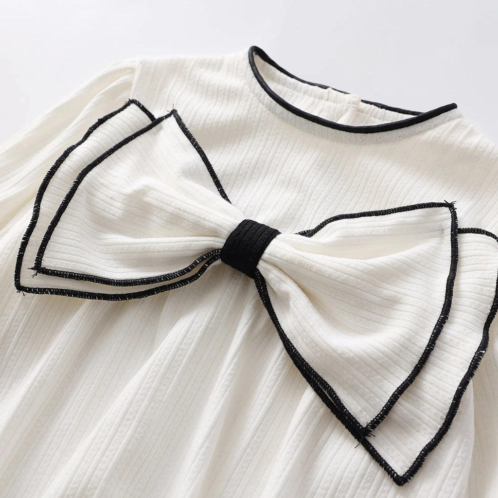 Cotton baby bow long sleeve onesie in black or white, triangle jumpsuit style, sizes 66-100cm