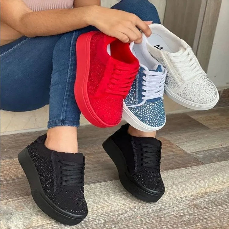 Women's black lace-up casual shoes with rhinestone detail and thick flat rubber sole.
