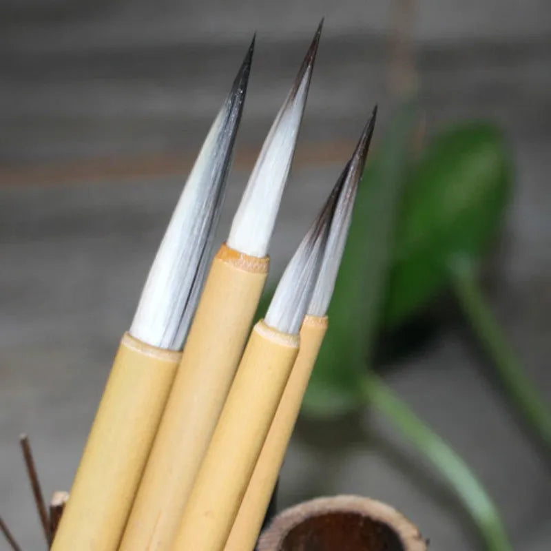 Four gold body writing brushes with wolf wool hook thread and mixed hair materials in pine branch set colour