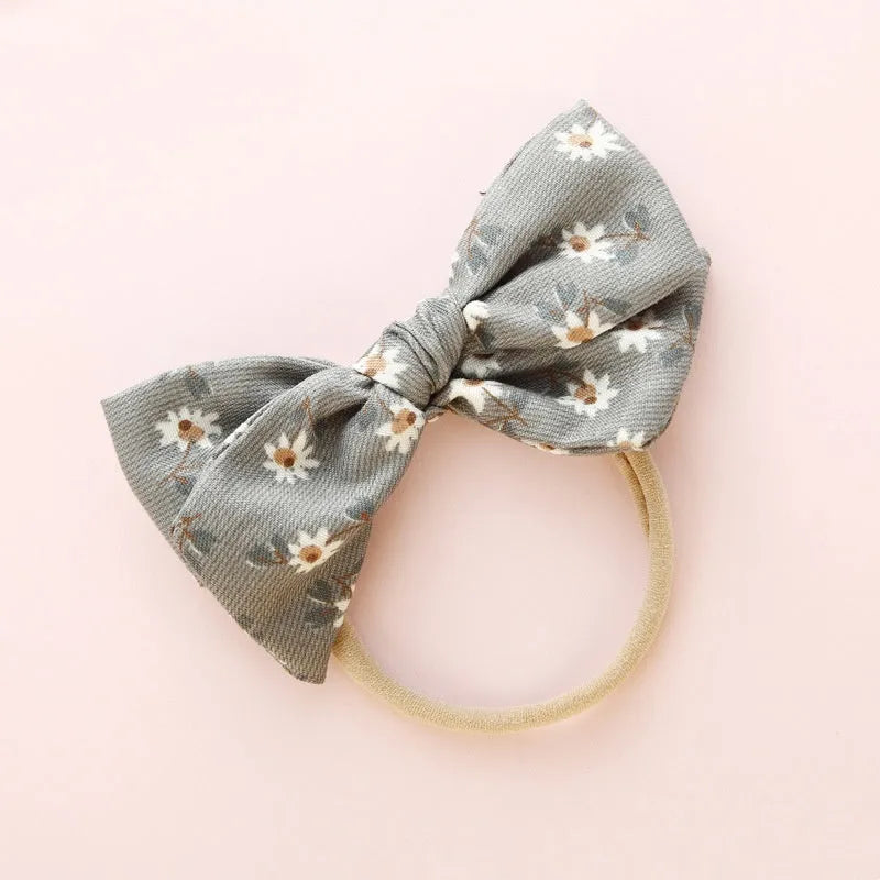 Children's fabric hairband with knotted bow design in multiple colours from Princess series