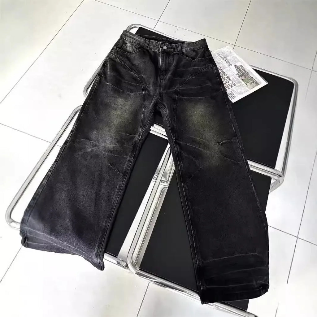 Mens washed black straight leg denim jeans with dirty mud texture and zip fly