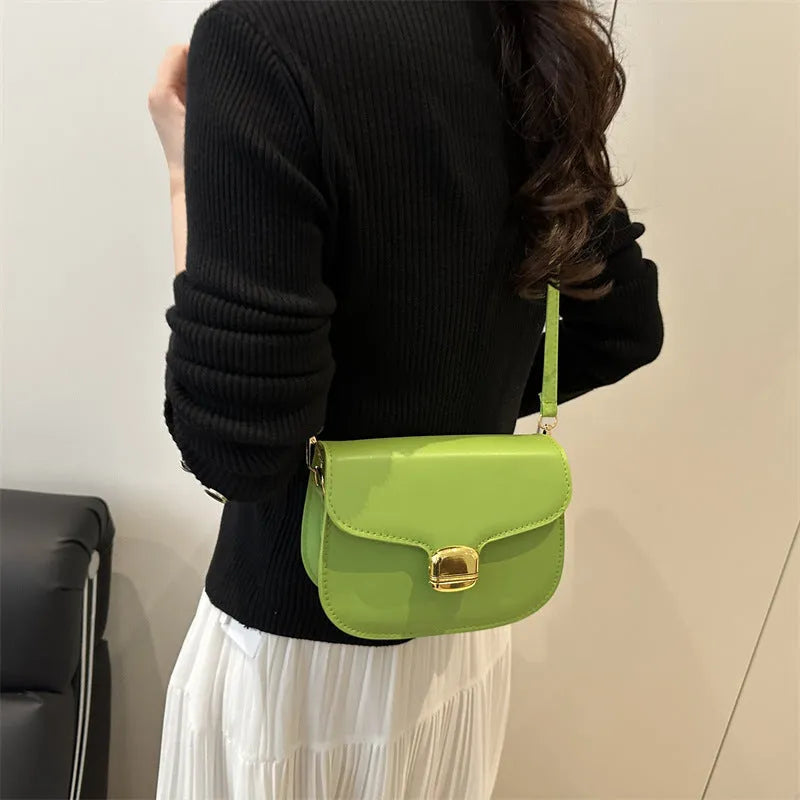 Simple PU women's handbag in khaki colour with internal phone and change pockets.