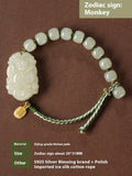 Year of the Rabbit Hetian jade charm bracelet with S925 silver detailing on a red cotton rope.