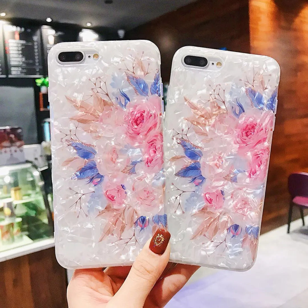 Dream Shell soft TPU silicone iPhone case with a rose flower design on the back, shown in brown colour.