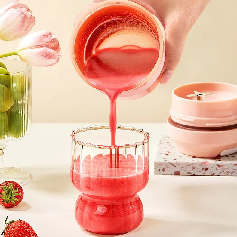 Grape purple portable USB blender cup with lid, showing stainless steel blades inside 400ml capacity bottle.