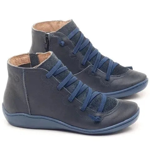 Women's casual flat booties with a wedge heel and round toe in a selection of colours including leopard print.