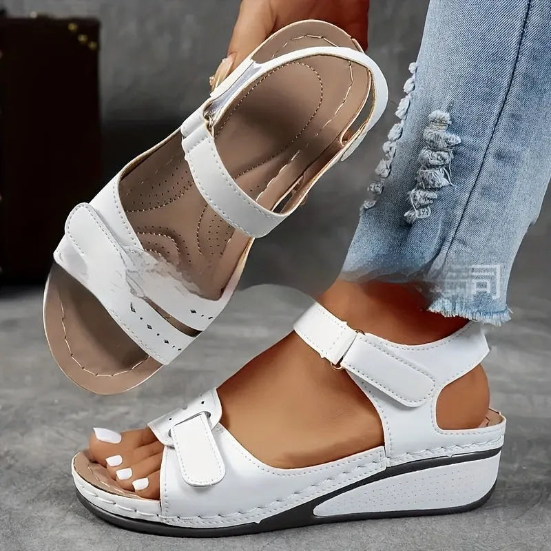 Women's thick bottom strap sandals with Velcro fastening in beige colour showing round toe and composite sole