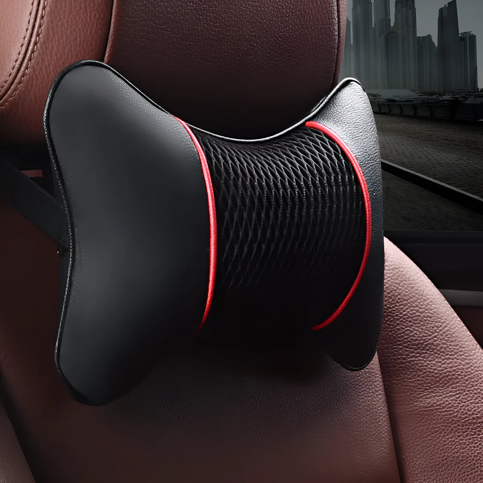 Green leather car headrest neck pillow with black red reversible colour, placed on a car seat for neck support