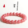 Geometric red crystal women's bracelet with a longevity lock fastening on a wrist.