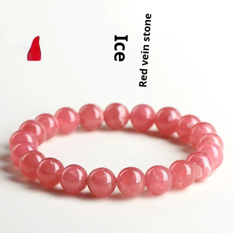 Geometric red crystal women's bracelet with a longevity lock fastening on a wrist.