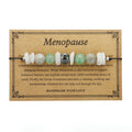 Women's geometric stone bead bracelet in earthy colours on a wrist, showcasing angular bead shapes.