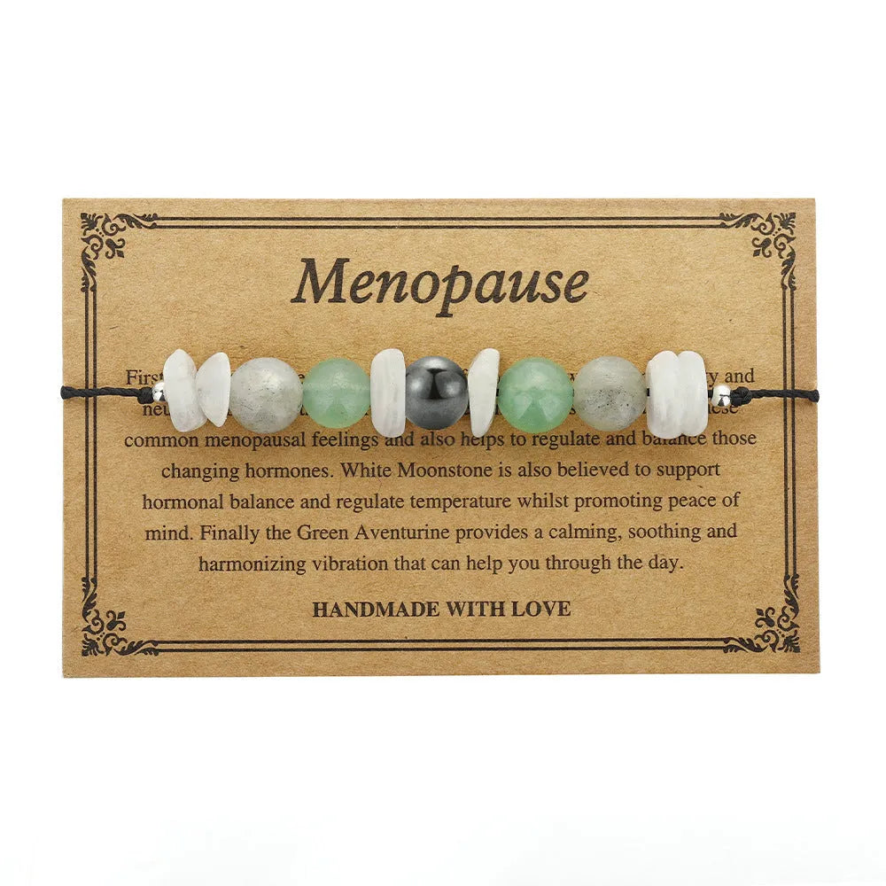 Women's geometric stone bead bracelet in earthy colours on a wrist, showcasing angular bead shapes.