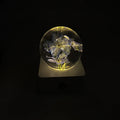 8cm dandelion and sunflower specimen night light with USB cable on a desktop.