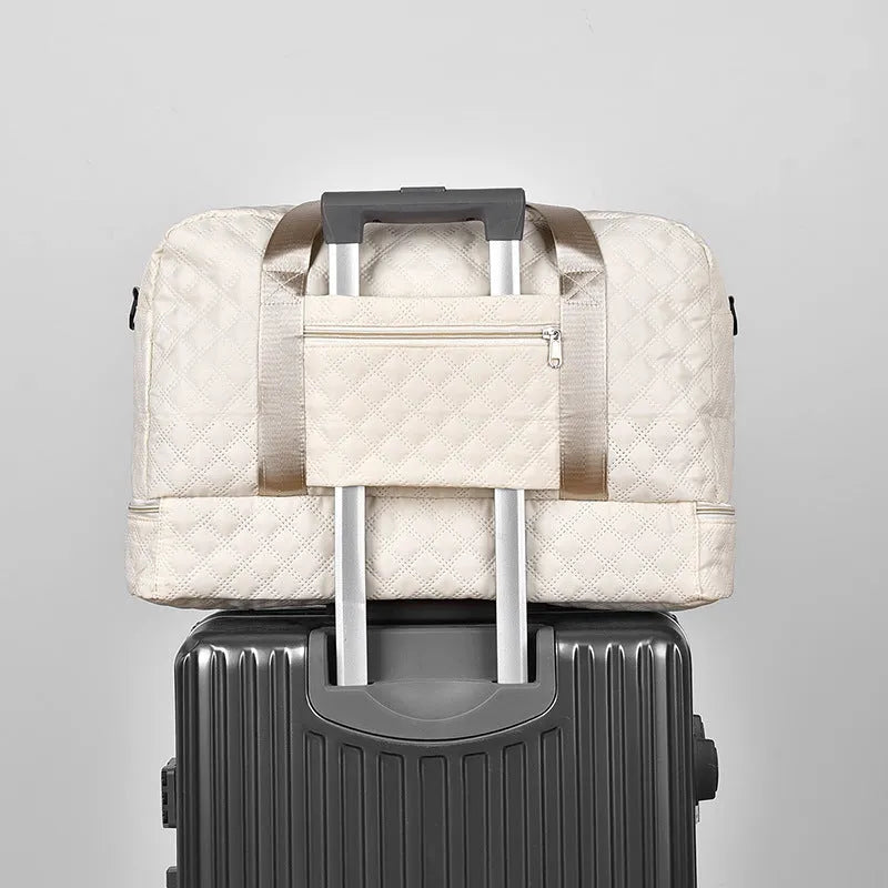 Large 55-litre buggy style travel bag in Oxford cloth, shown in a solid colour with shoulder straps.