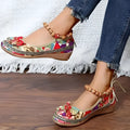 Women's black plus-size ethnic platform sandals with cloth upper and elastic band strap.