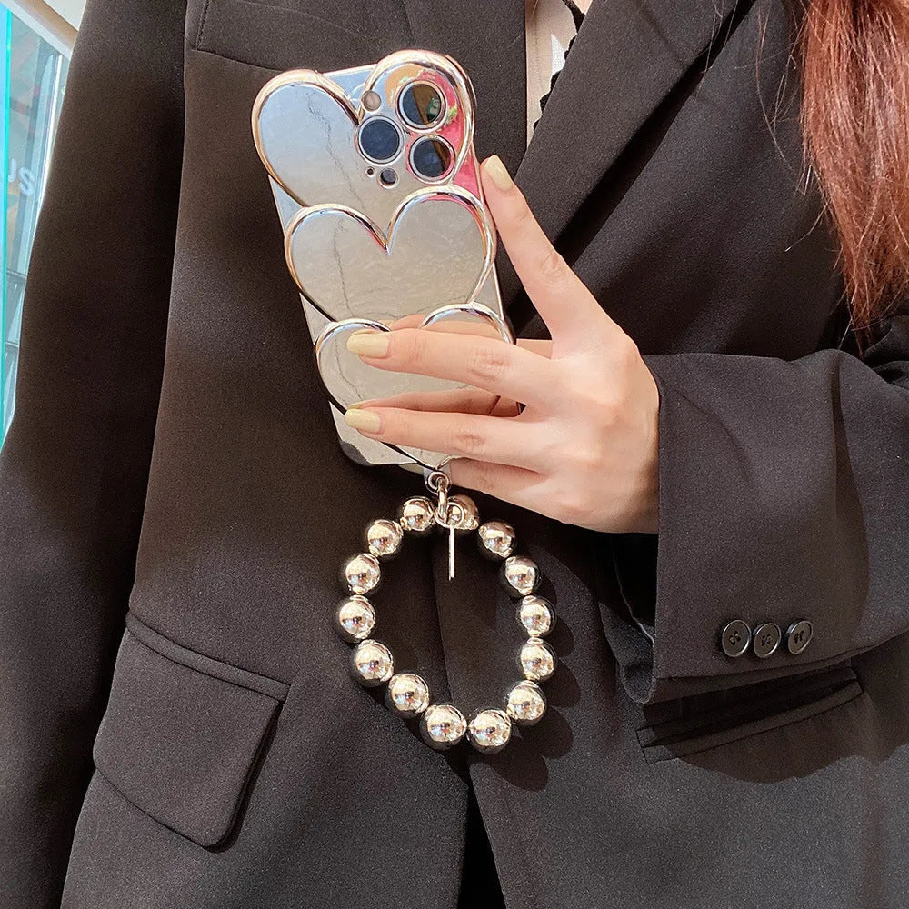 Electroplating love design on a soft TPU iPhone mobile phone case, shown next to a matching bracelet.