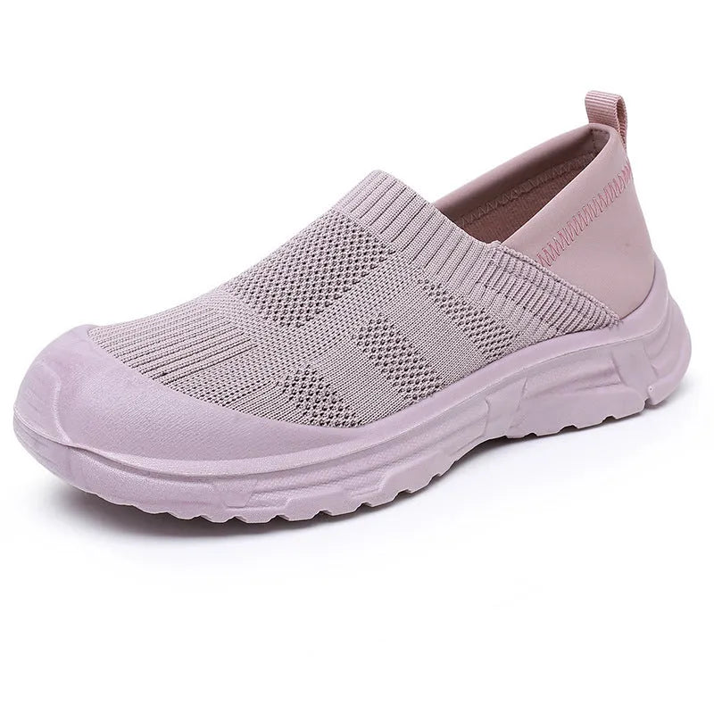 Women's black slip-on shoes with cloth upper and PVC sole in round-toe design