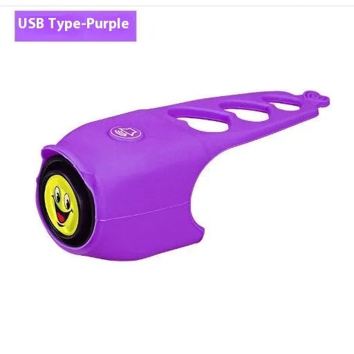 A plastic electronic bicycle horn in one of six colours, showing its compact shape for handlebar mounting.