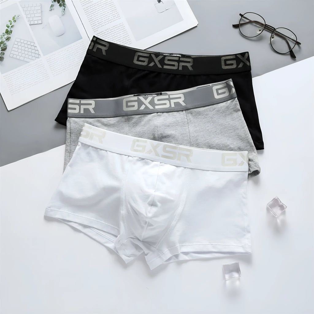 Men's purified cotton low waist boxer shorts in solid white, black, or grey, sizes M to XXL