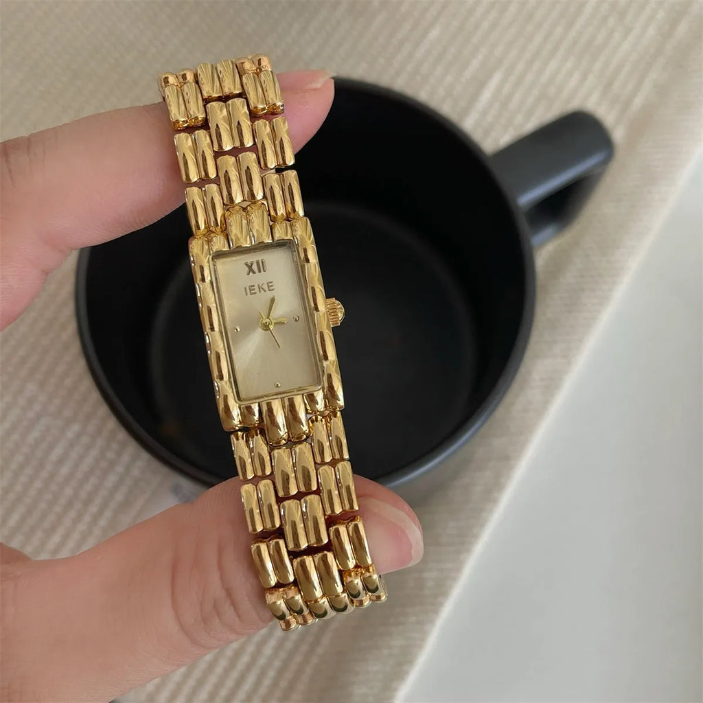 Bracelet-style silver and gold women's Ins watch showing 15mm dial and butterfly clasp.