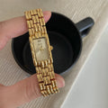 Bracelet-style silver and gold women's Ins watch showing 15mm dial and butterfly clasp.