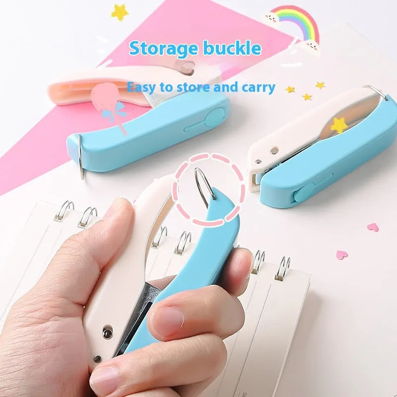 Small manual handheld punching machine with embossed love, star, and round shape cutters for paper crafts.