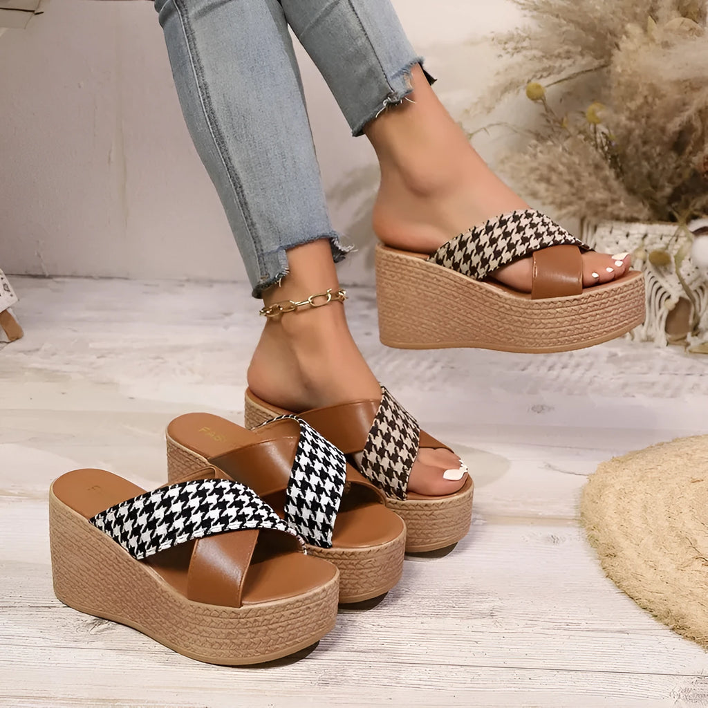Brown and black plaid patterned casual wedge sandals with a rubber sole, shown on a white background.