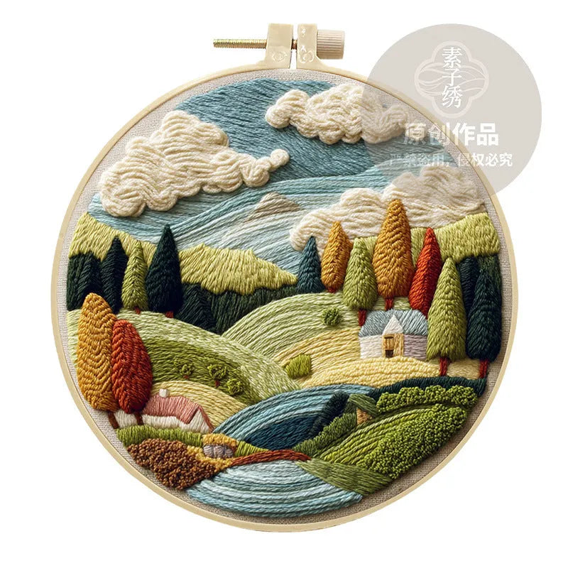 Embroidery DIY kit with cotton linen fabric, bamboo hoop, threads, and needles for landscape designs.