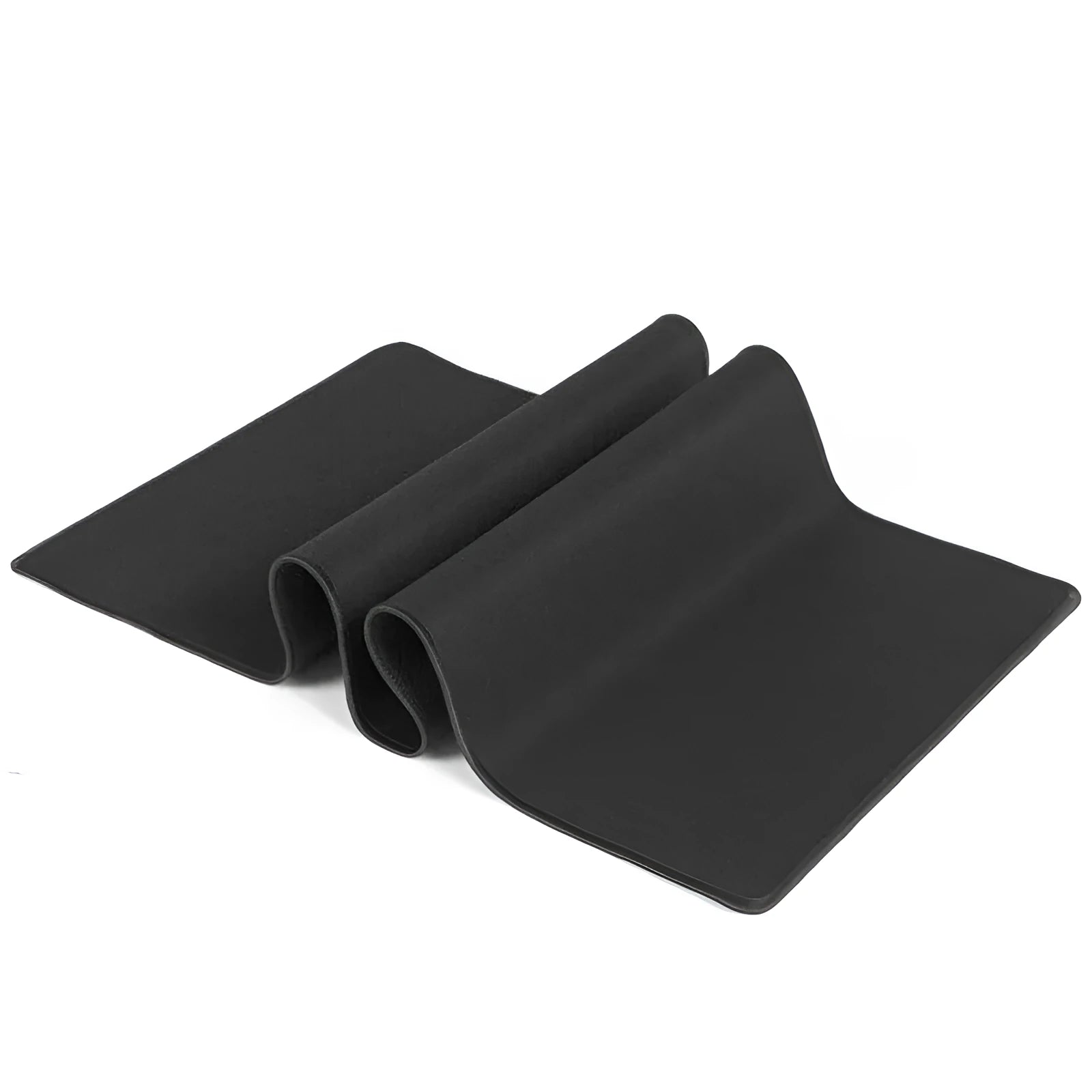 All black extra long desk mat with overlock stitching on a wooden desk with keyboard and mouse.