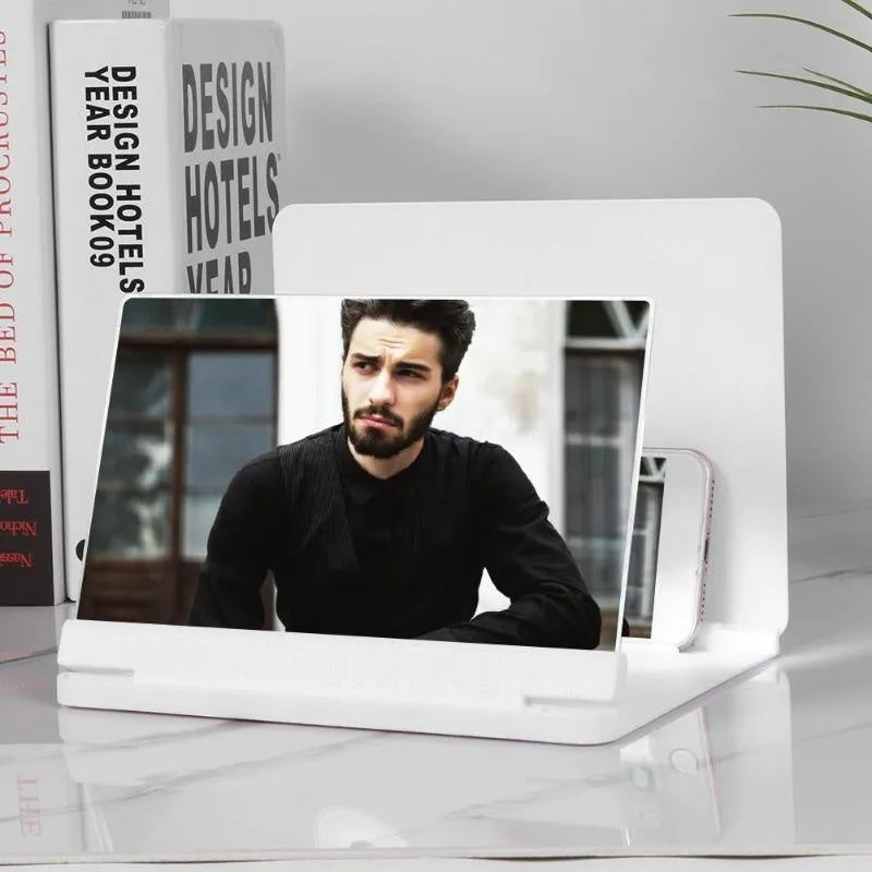 White phone screen amplifier showing smartphone magnification with plexiglass lens and fibreboard frame
