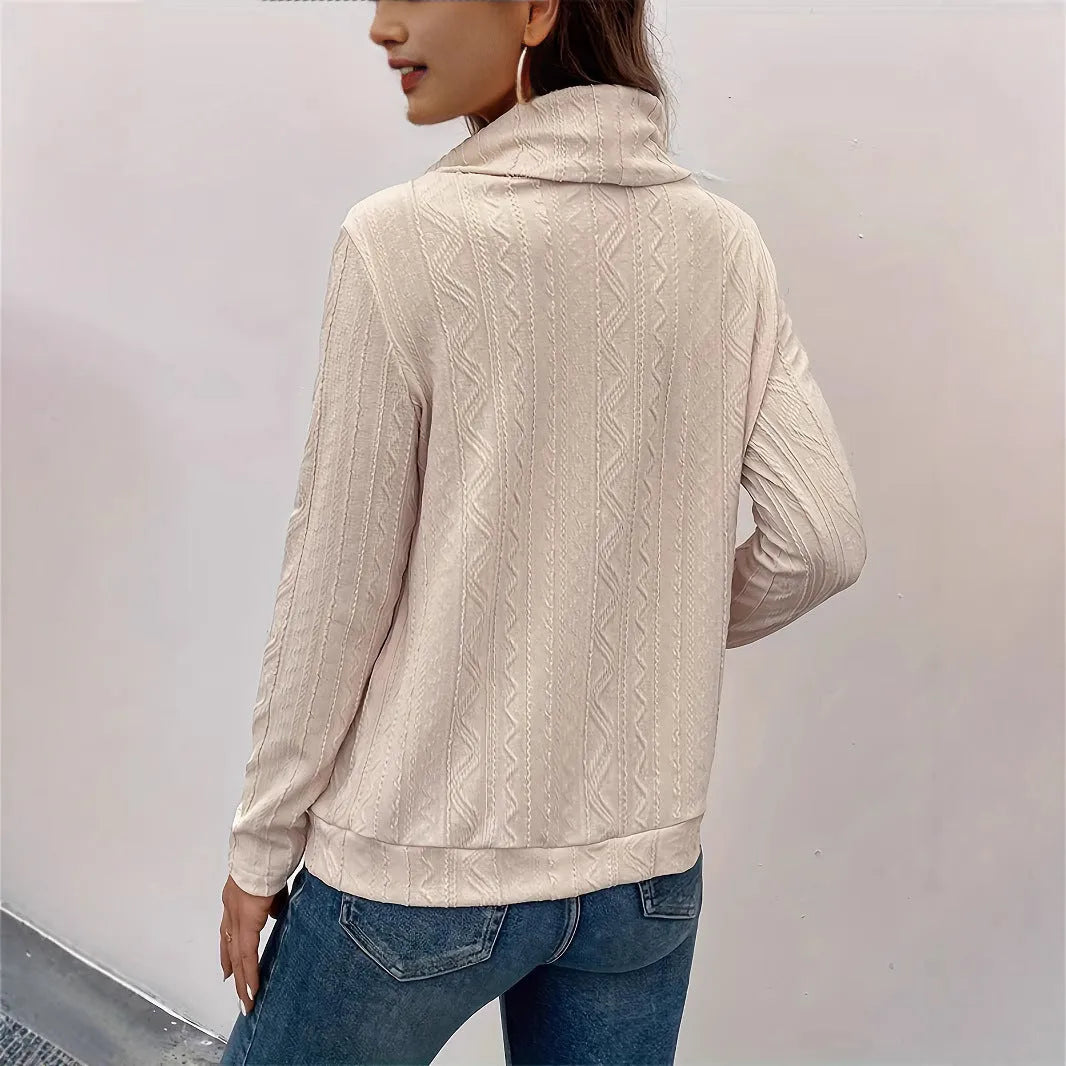 Apricot hooded pullover sweater with long sleeves on hanger