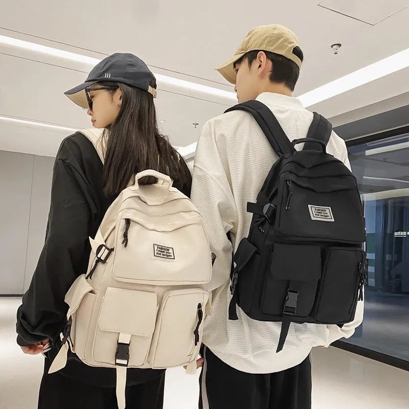 Black and white soft nylon student backpack with laptop compartment and three-dimensional pockets