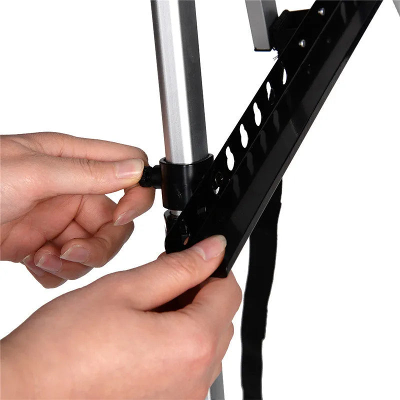 Silver aluminium alloy adjustable easel with metal tray in collapsed position on a tabletop